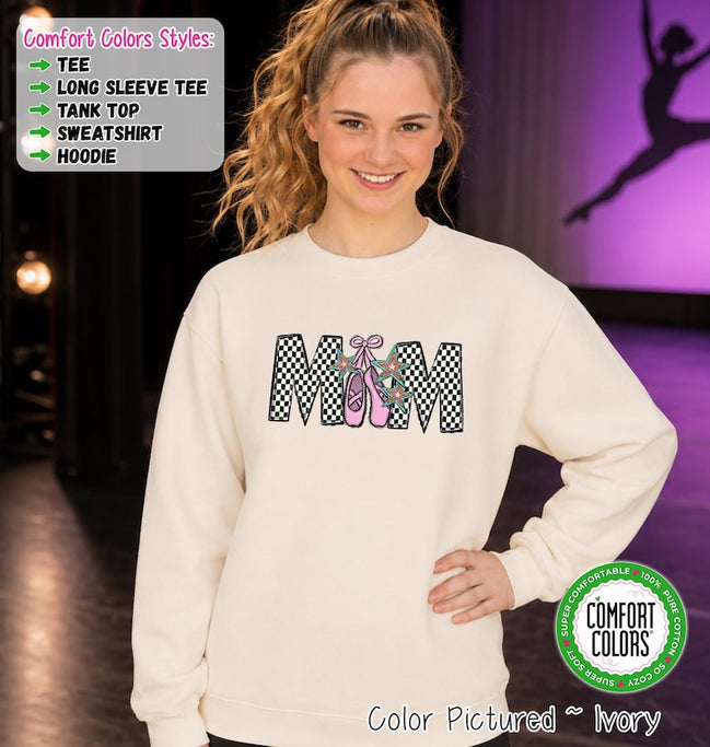 May include: An ivory crewneck sweatshirt featuring the word MOM in a black and white checkered pattern. The letter O is replaced by a pair of pink ballet slippers with ribbons and two teal star-shaped accents. Text boxes list style options.