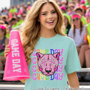 May include: A light mint green t-shirt featuring a graphic of a pink panther head wearing star-shaped glasses, surrounded by the repeating text 