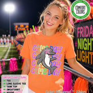 May include: An orange short-sleeve t-shirt featuring a graphic of a grey dolphin with a pink star over its eye. The text 