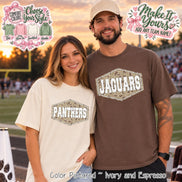 Two short-sleeve crew neck t-shirts. One is ivory with a central hexagonal graphic containing a camouflage pattern and the white text PANTHERS. The other is espresso brown with a matching hexagonal graphic and the white text JAGUARS.