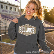 A pepper-colored hooded sweatshirt featuring a central hexagonal graphic with a camouflage pattern and the white text BULLDOGS in a bold, block-style font. The garment includes a front kangaroo pocket and long sleeves.