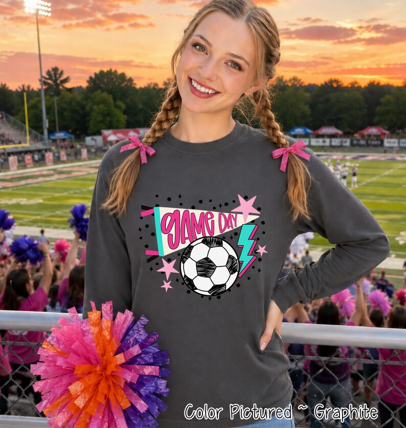 A charcoal gray long-sleeve sweatshirt featuring a graphic print with the text 