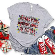 She is clothed in Buffalo Plaid Christmas Movie Tee