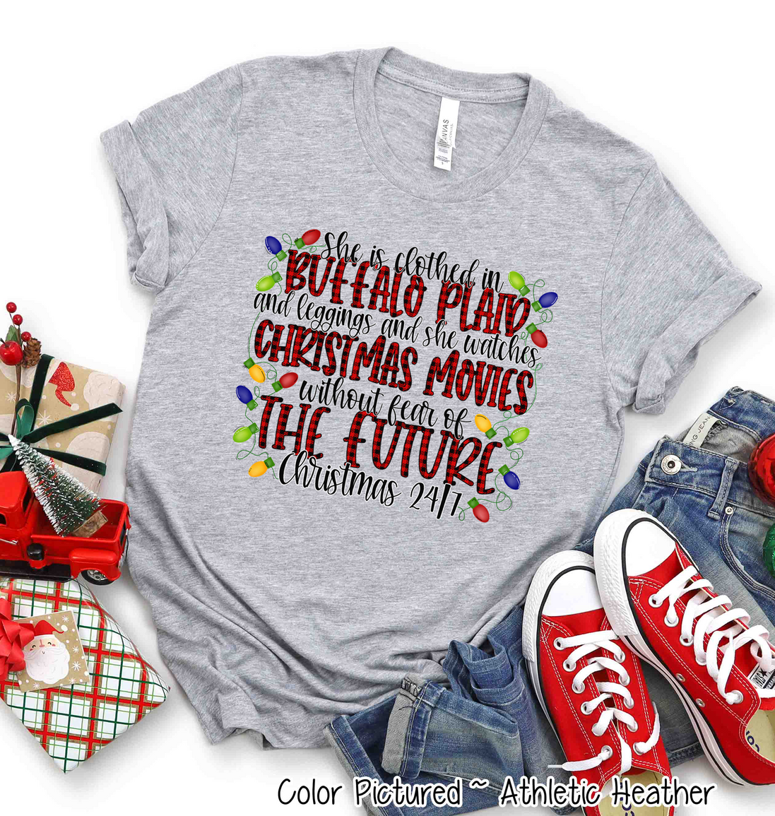 She is clothed in Buffalo Plaid Christmas Movie Tee