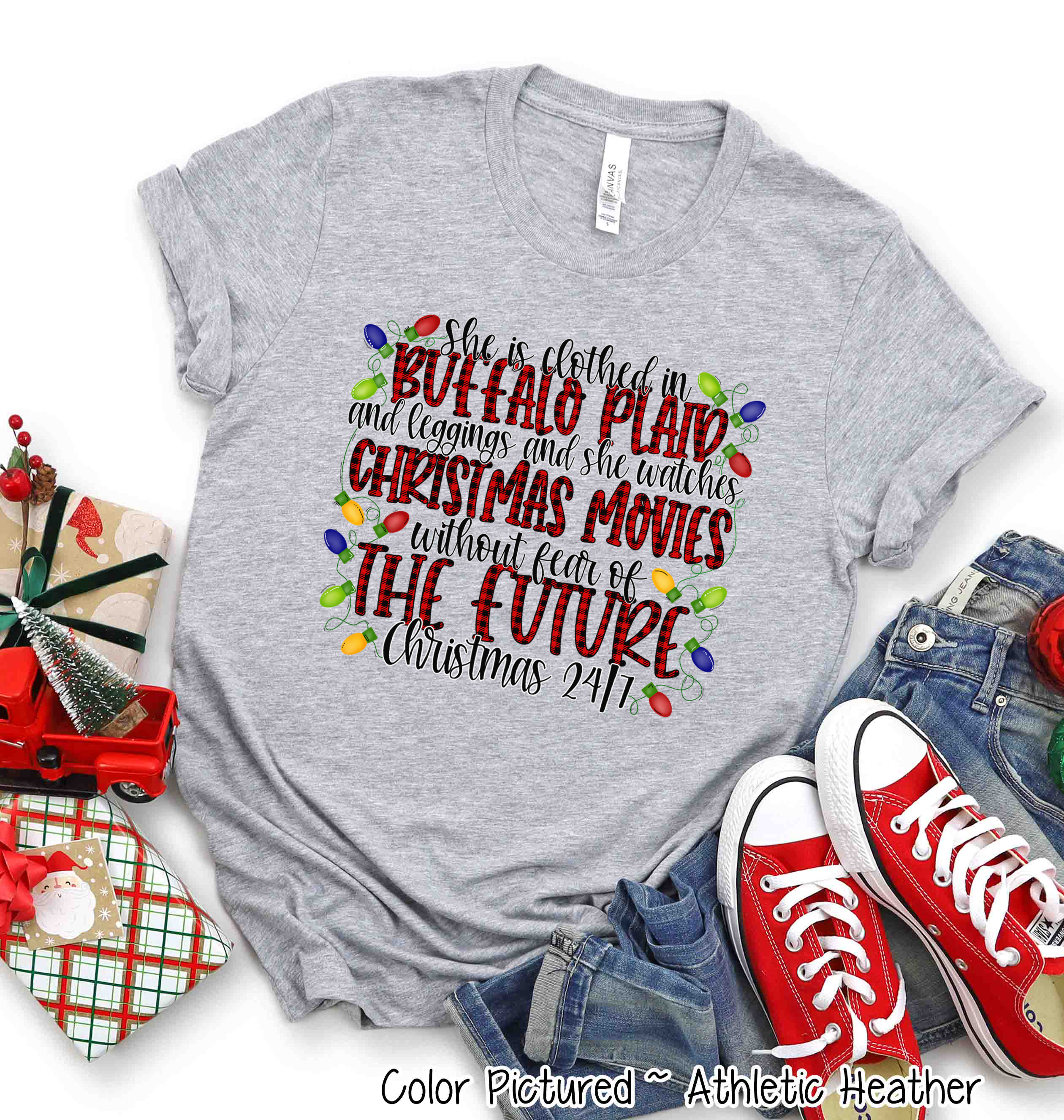 She is clothed in Buffalo Plaid Christmas Movie Tee