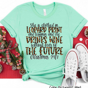 She is clothed in Leopard Print Christmas Movie Tee