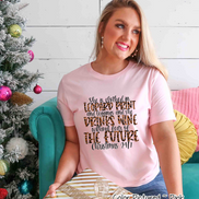 She is clothed in Leopard Print Christmas Movie Tee
