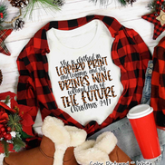 She is clothed in Leopard Print Christmas Movie Tee