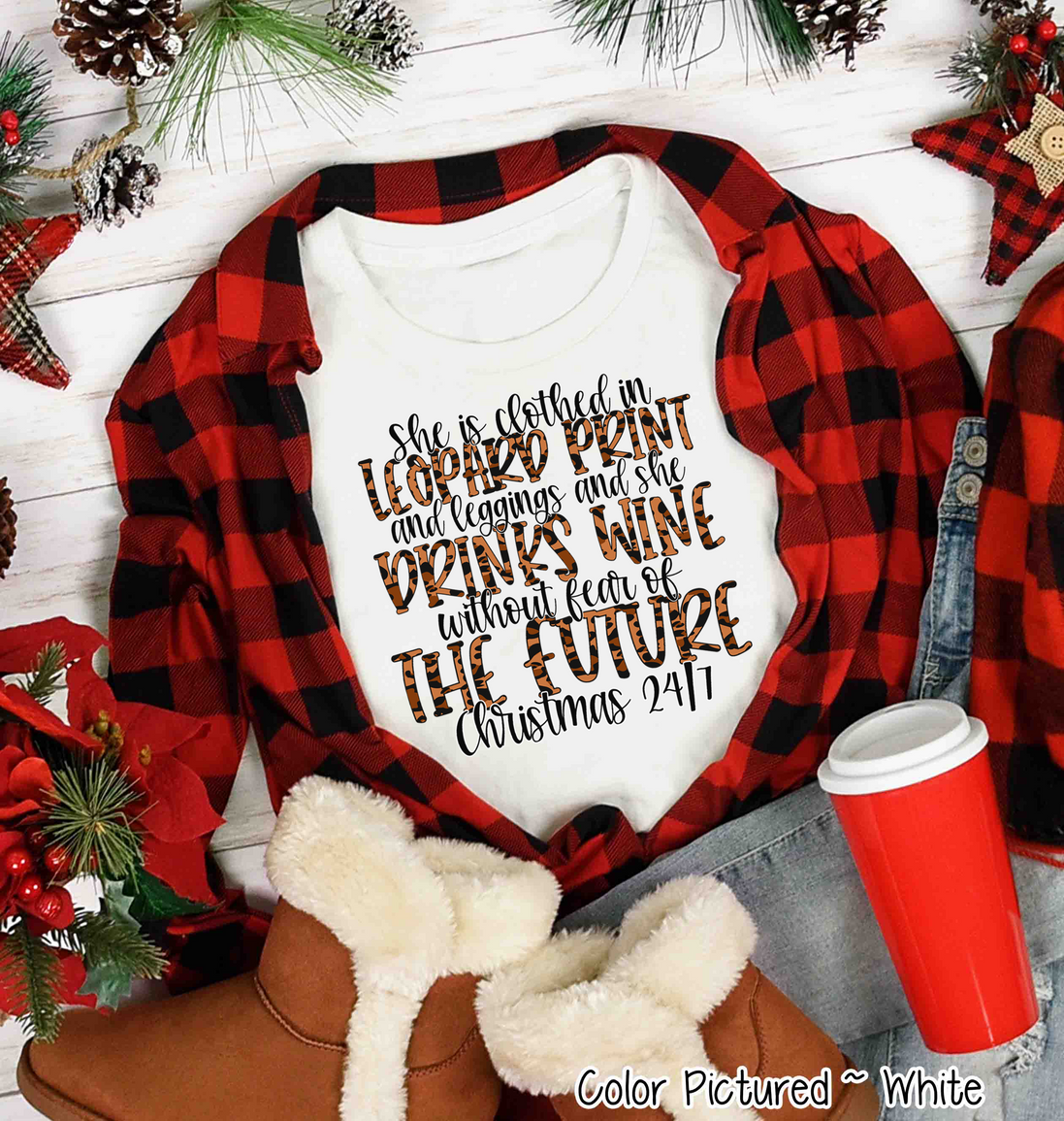 She is clothed in Leopard Print Christmas Movie Tee