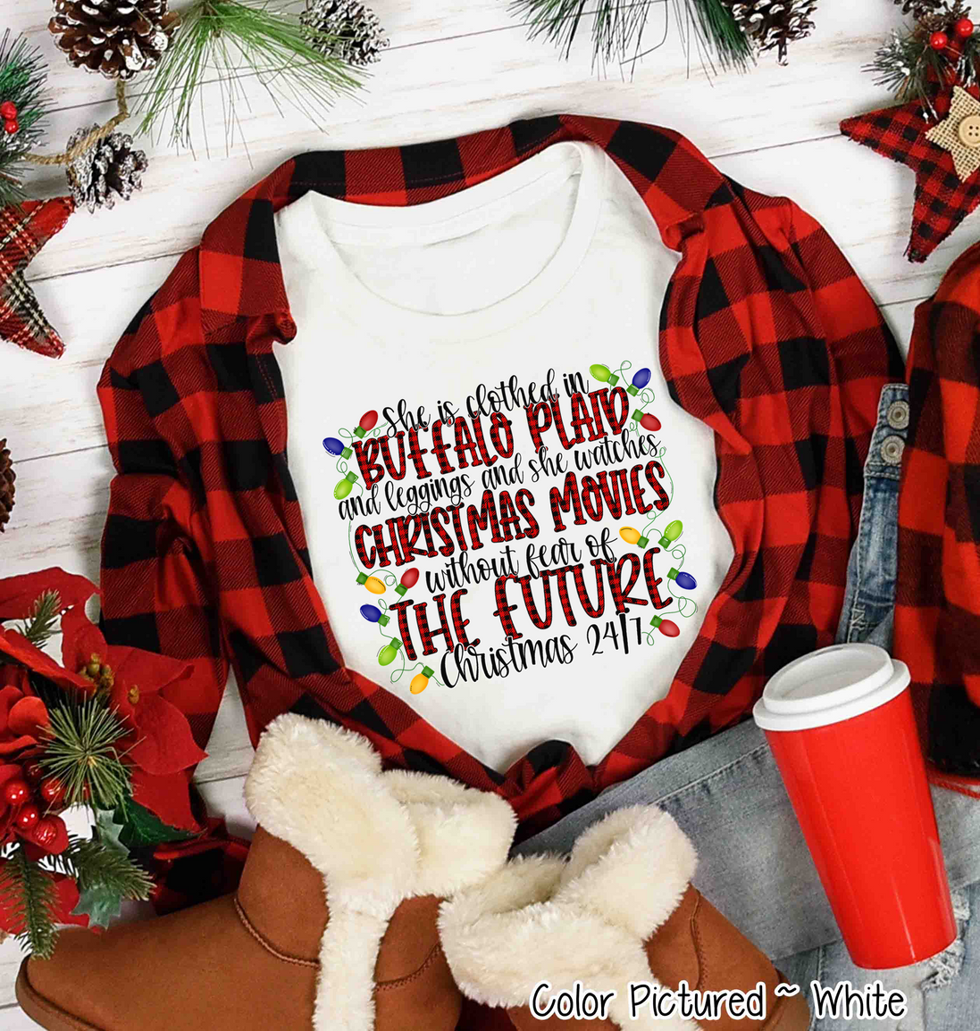 She is clothed in Buffalo Plaid Christmas Movie Tee