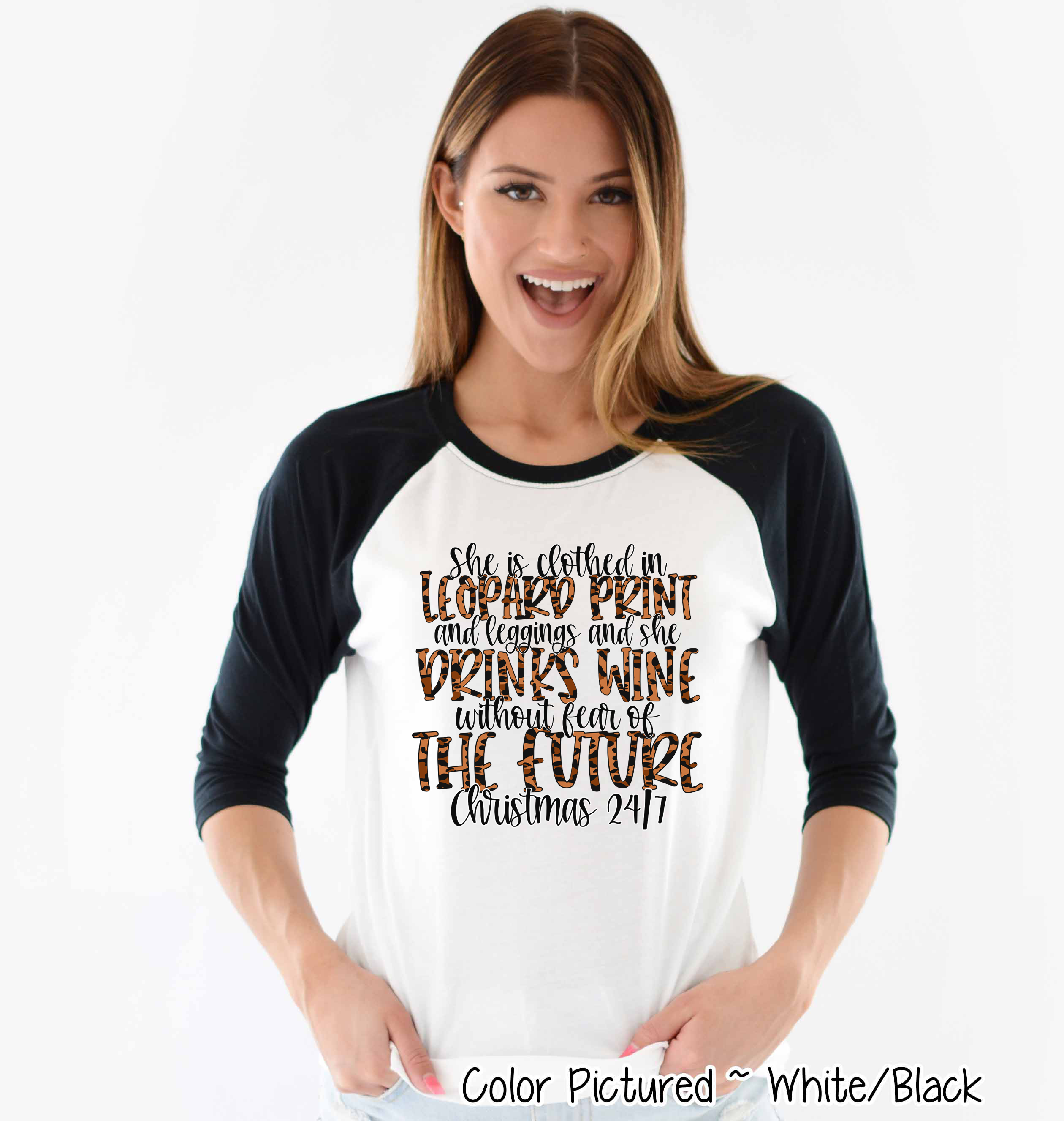 She is clothed in Leopard Print Christmas Movie Raglan Tee